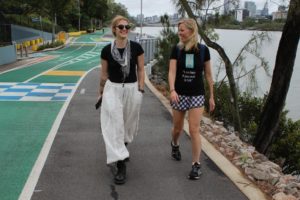 Eleanor Goldfield and Casey Davidson walking in Brisbane