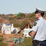 Police Officer looking out over the camp